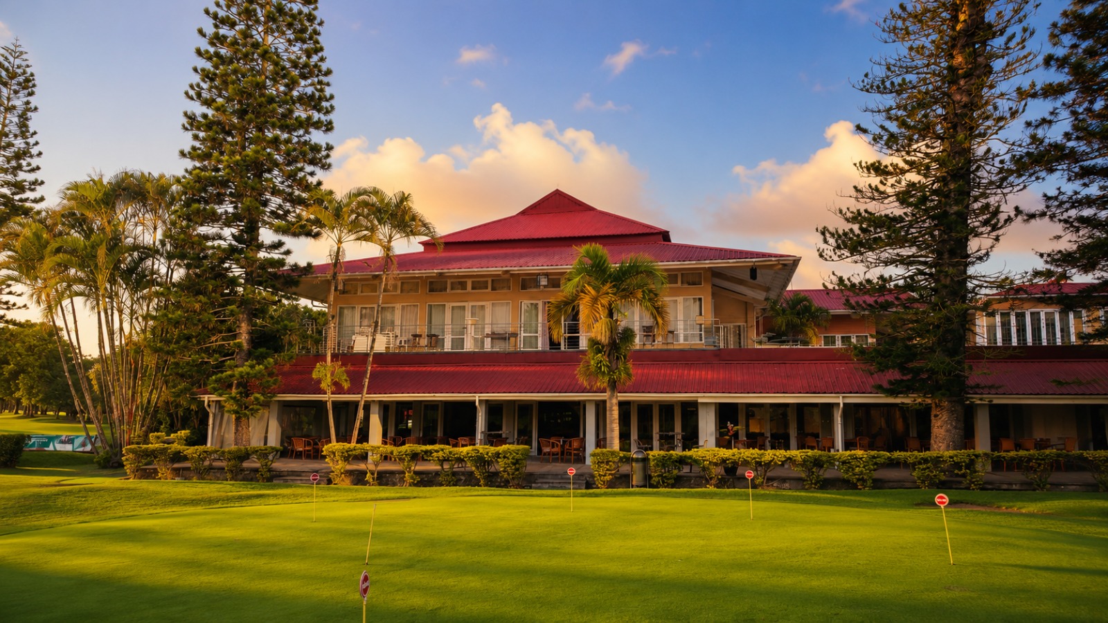 The clubhouse and putting green at golden hour